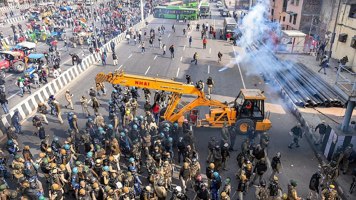 Police used tear gas to disperse farmers attempting to break barricades at Ghazipur border during their Kisan Gantantra Parade, on the occasion of 72nd Republic Day.