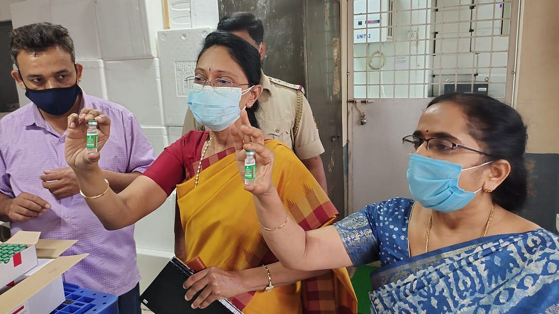 Healthcare workers showing the vaccines arrived in Bengaluru on Tuesday, 12 January. 