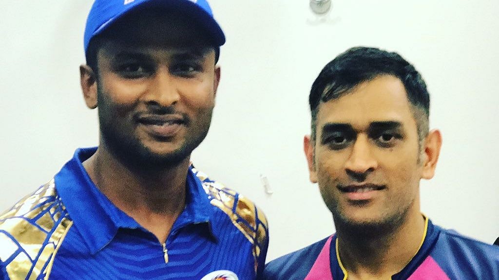 K Gowtham and MS Dhoni. 