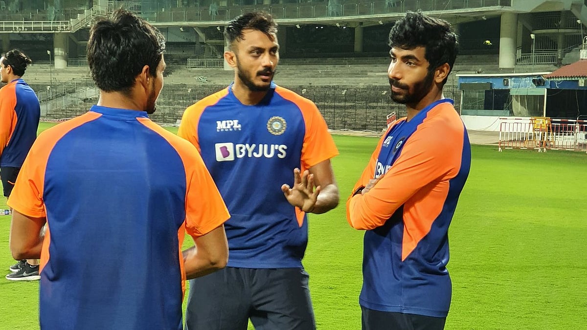 Axar Patel and Jasprit Bumrah in conversation during India’s training session in Chennai. 