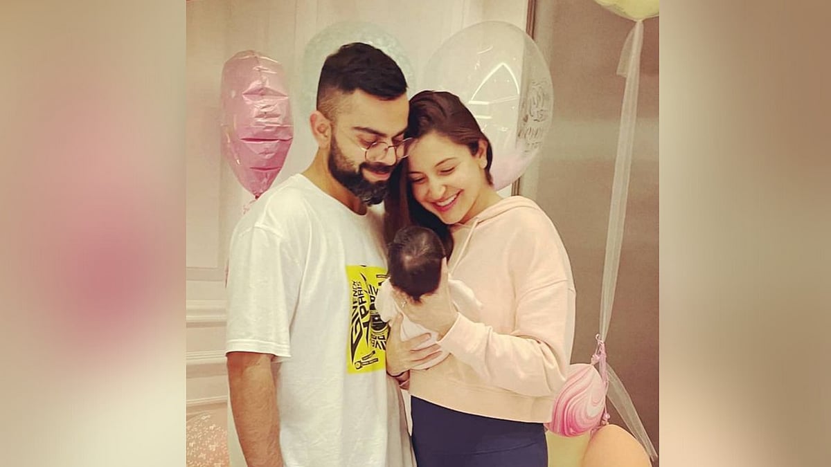 Virat Kohli and Anushka Sharma with their baby daughter.