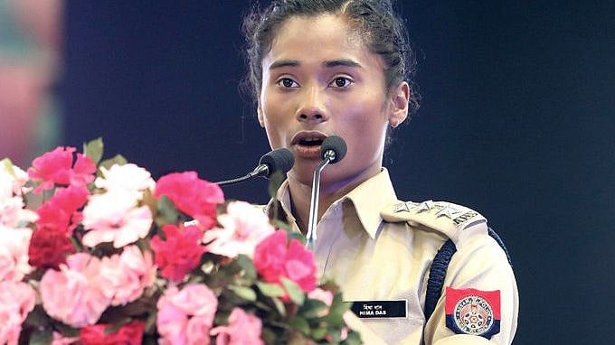 Hima Das speaking during her induction ceremony. 