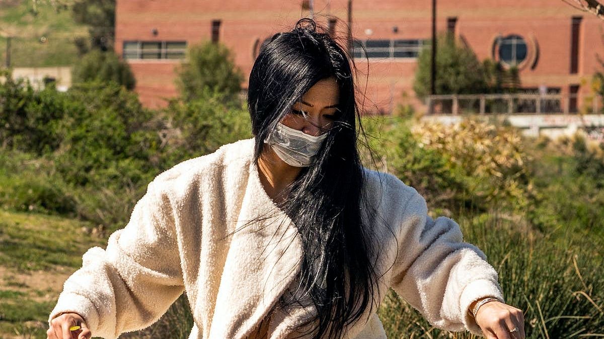 Lisa Nhan puts on a musical performance with crystal bowls in Los Angeles on Feb. 20 as part of an event to call attention to anti-Asian violence and racist attitudes. 