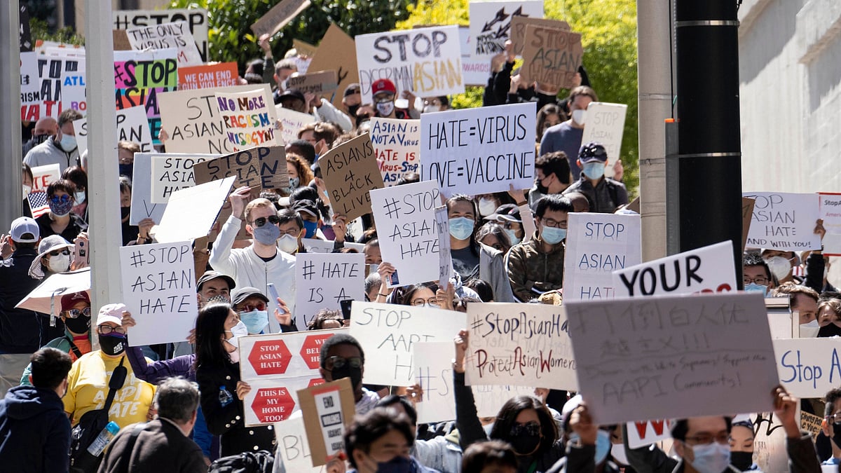 People march away from the Georgia State Capitol in Atlanta during a unity “Stop Asian Hate” rally on Saturday, 20 March. 