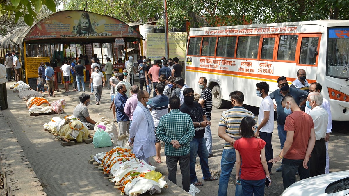 Bodies lined up for cremation, amid surge in COVID-19 cases across country, at Hindon river crematorium in Ghaziabad, Friday, 16 April, 2021. 