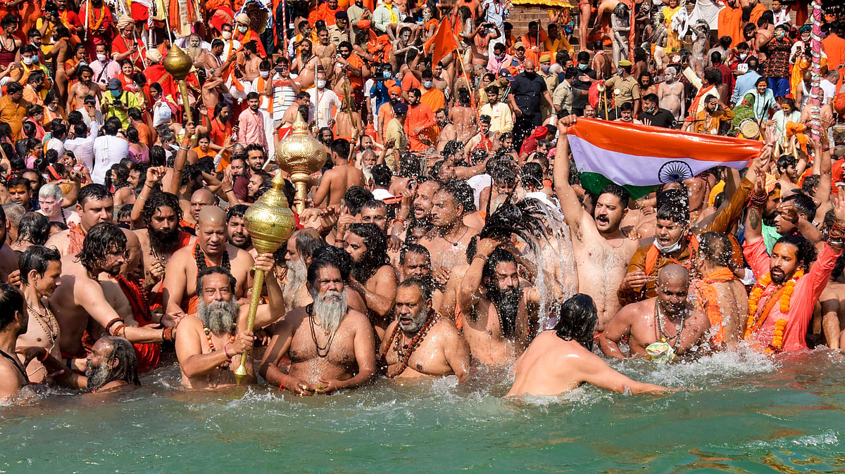 Devotees gather to offer prayers during the third Shahi Snan of the Kumbh Mela 2021, at Har ki Pauri Ghat in Haridwar.&nbsp;