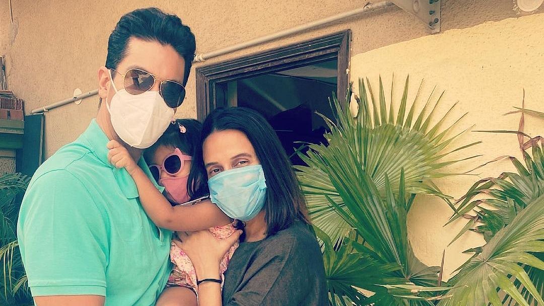 <div class="paragraphs"><p>Angad Bedi and Neha Dhupia with their daughter Mehr</p></div>