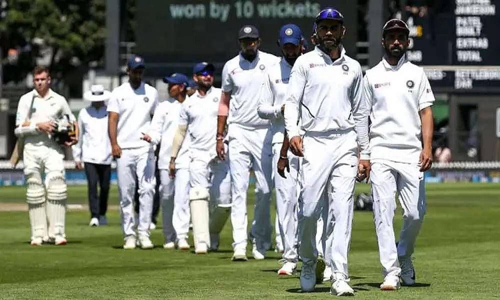 Virat Kohli and India walk off the field. 
