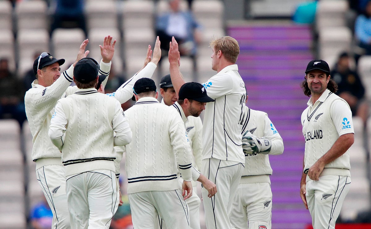 New Zealand’s Kyle Jamieson, second right, celebrates with teammates the dismissal of India’s captain Virat Kohli during the third day of the World Test Championship final.