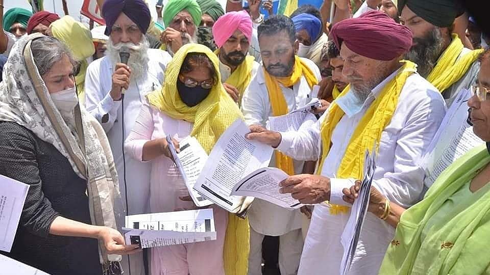 Bharatiya Kisan Union (BKU) (Ugrahan) in Punjab, burning copies of the three farm laws.