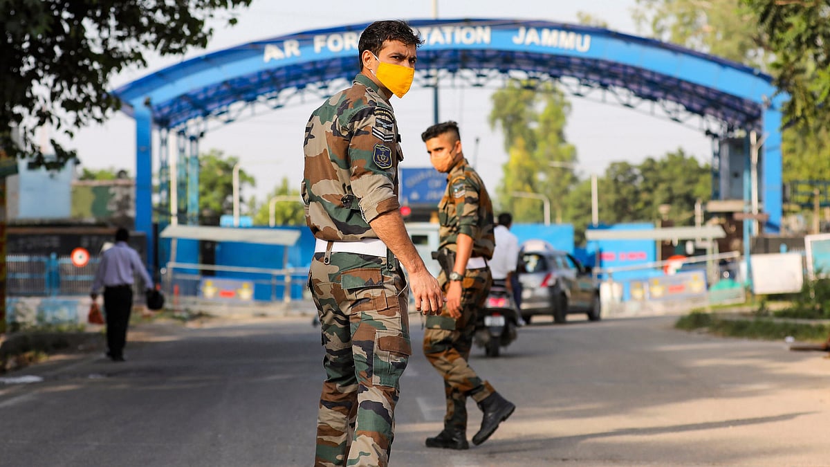 Security personnel patrol after two low intensity explosions reported in the technical area of Jammu Air Force Station in the early hours of Sunday. 