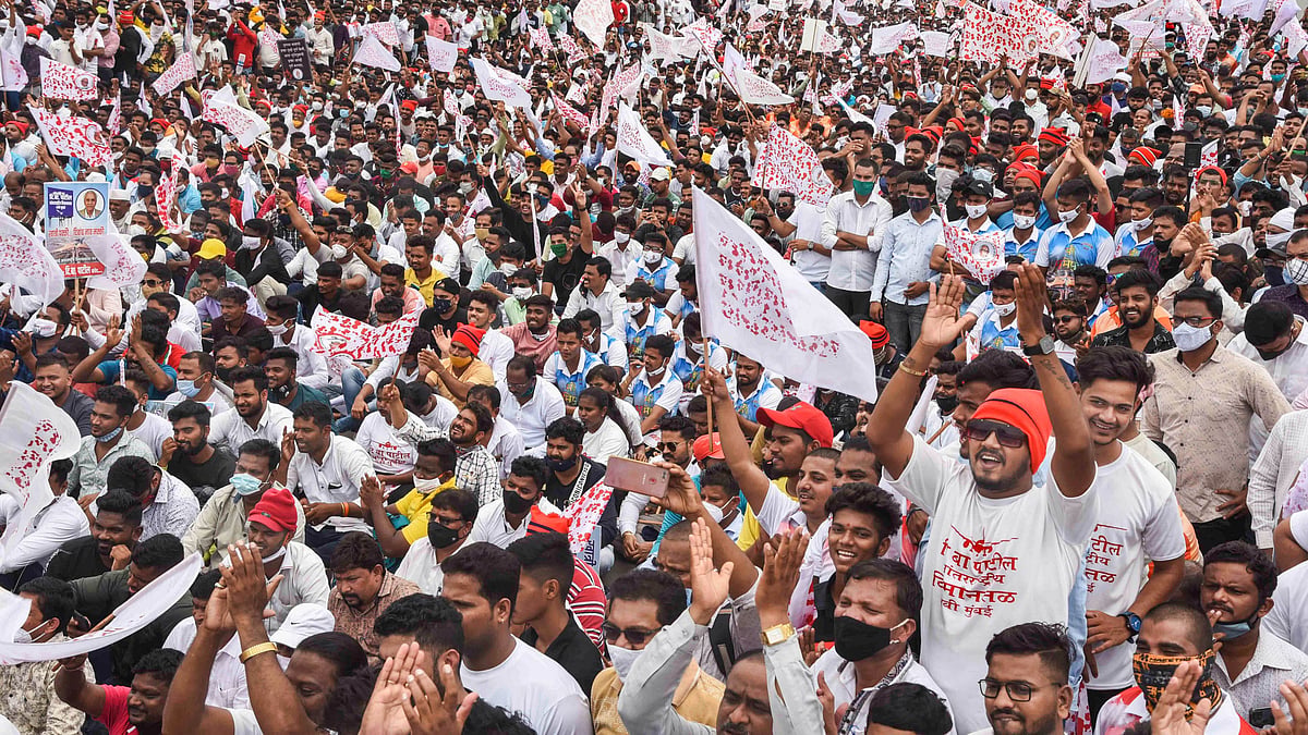 Navi Mumbai Locals gather at Palm Beach Road near CBD Belapur as they protest against the naming of Navi Mumbai International Airport, in Navi Mumbai, Thursday.
