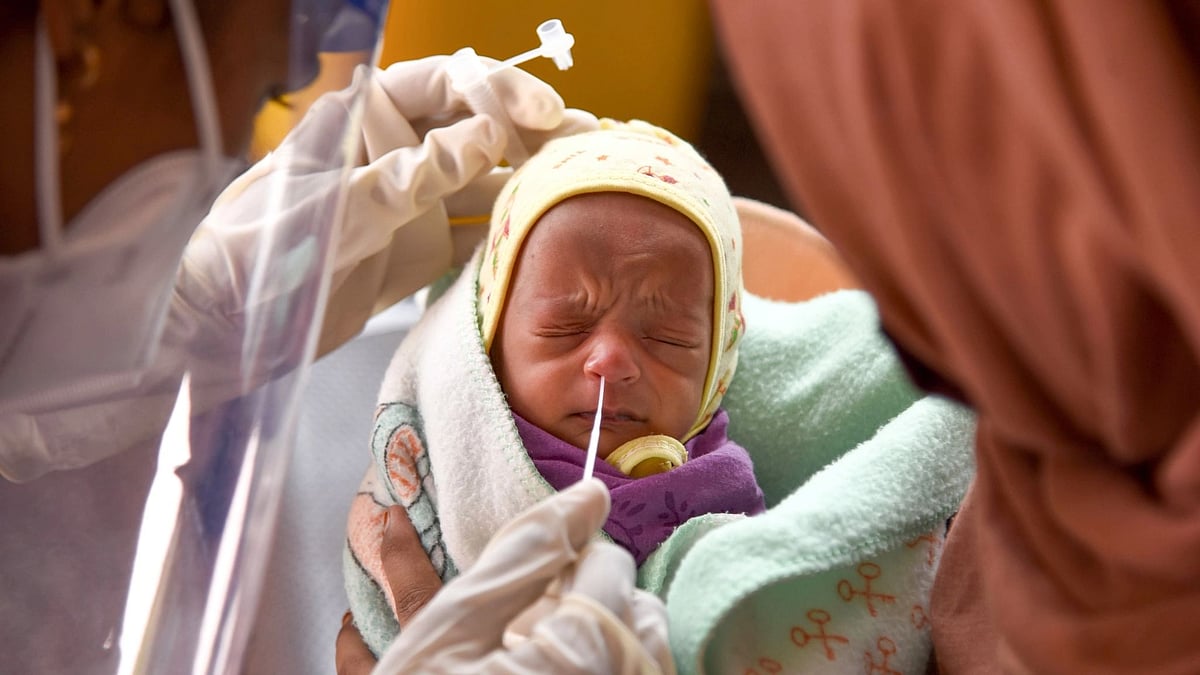A medic collects swab sample of an infant for COVID-19 test, at a hospital, at Nerul, Navi Mumbai on 4 June.