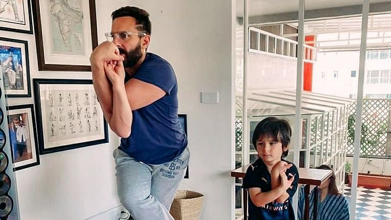 <div class="paragraphs"><p>Saif Ali Khan and Taimur doing some yoga on International Yoga Day.</p></div>