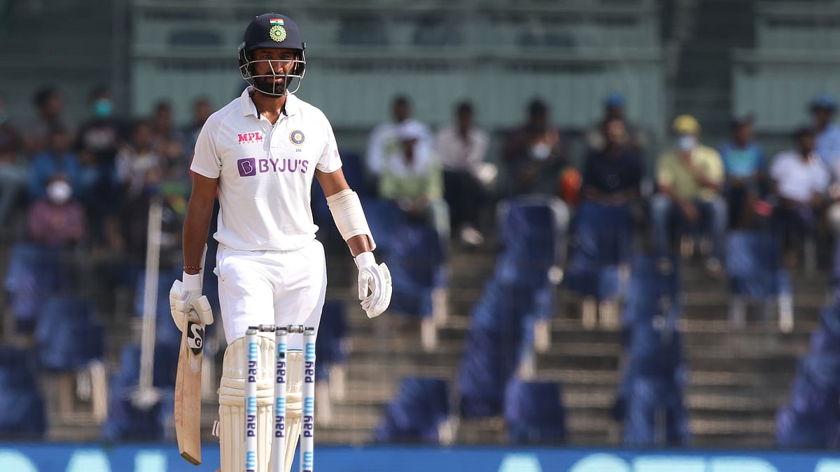 Cheteshwar Pujara walks back after being dismissed.&nbsp;