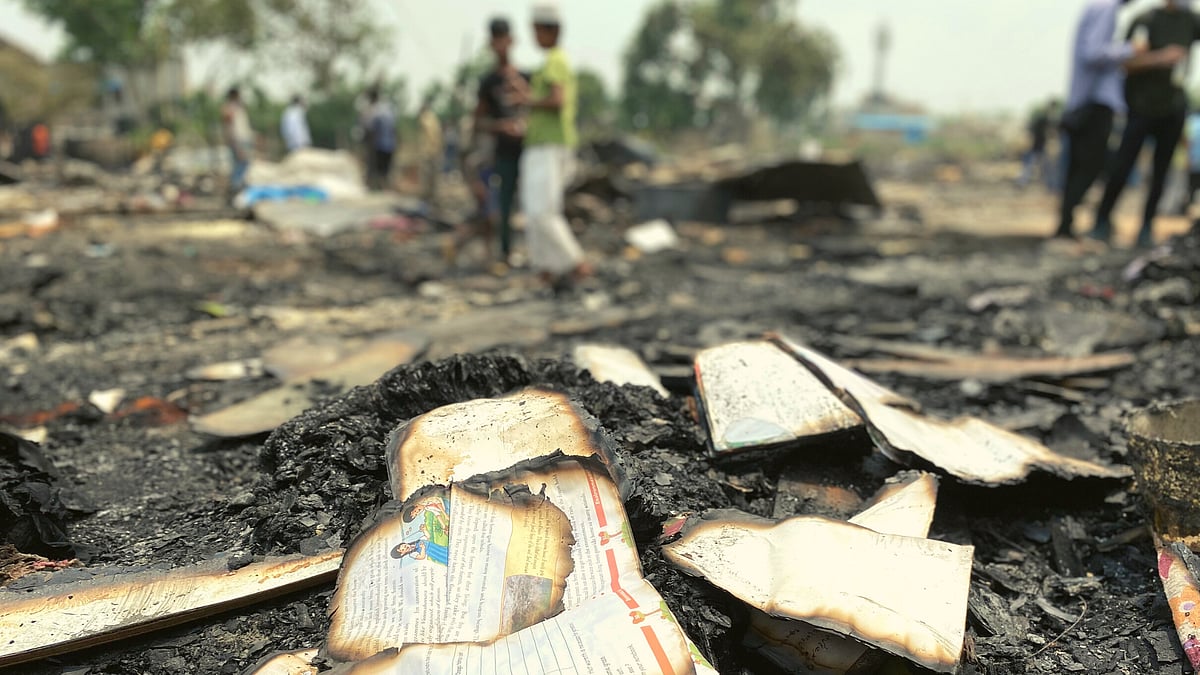 <div class="paragraphs"><p>Remnants of school books, destroyed in the Rohingya camp fire on 12 June. </p></div>