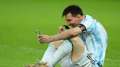 <div class="paragraphs"><p>Lionel Messi speaking to his family after Argentina won the 2021 Copa America. </p></div>