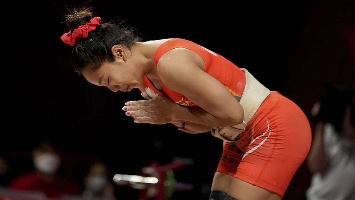 <div class="paragraphs"><p>Chanu Saikhom Mirabai of India competes in the women's 49-kg weightlifting event, at the Tokyo Olympics, on Saturday, 24 July.</p></div>
