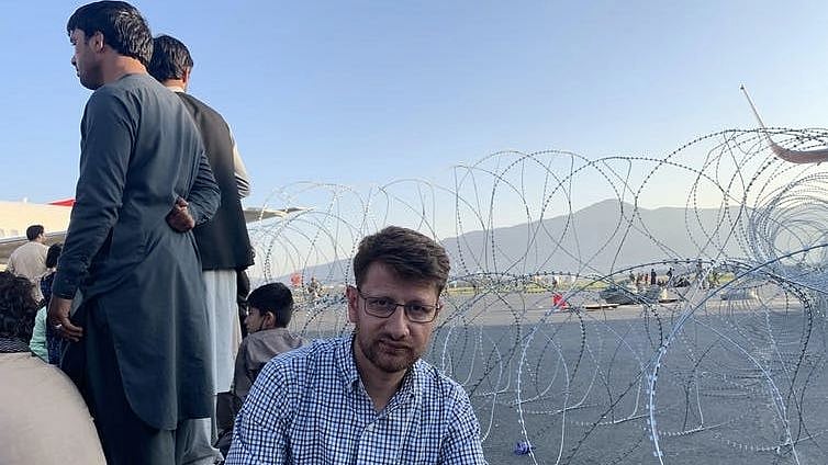 <div class="paragraphs"><p>Sufizada with others trying to leave Afghanistan at Kabul’s Hamid Karzai International Airport. </p></div>