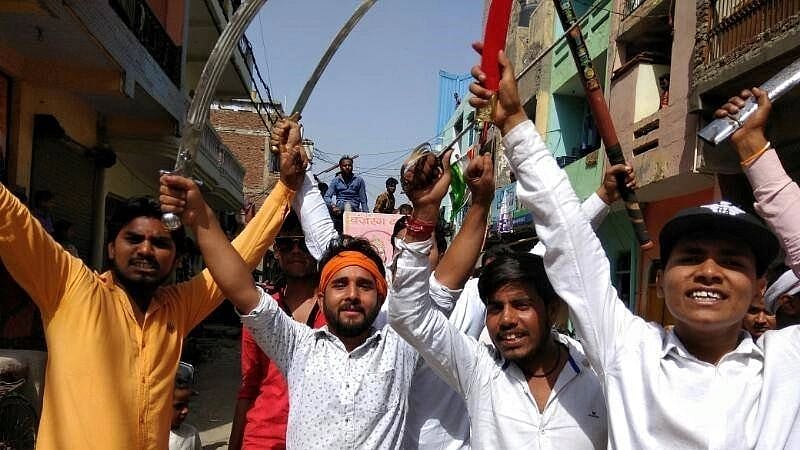 <div class="paragraphs"><p>Uttam (the one with the saffron cloth tied around his head) can be seen in several videos on social media, raising objectionable slogans against the minority community.</p></div>