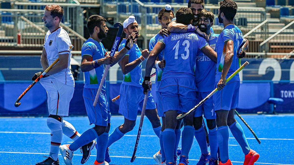 <div class="paragraphs"><p>Men's Hockey Team celebrate after scoring a goal against Germany.</p></div>