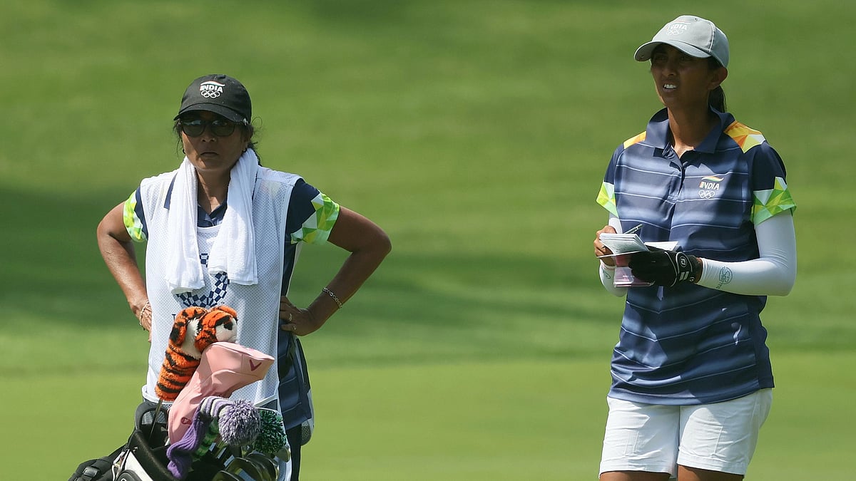 <div class="paragraphs"><p>A Watchful Guardian: Aditi Ashok is watched over by her mother, her caddy for this week, at the Tokyo Olympics</p></div>