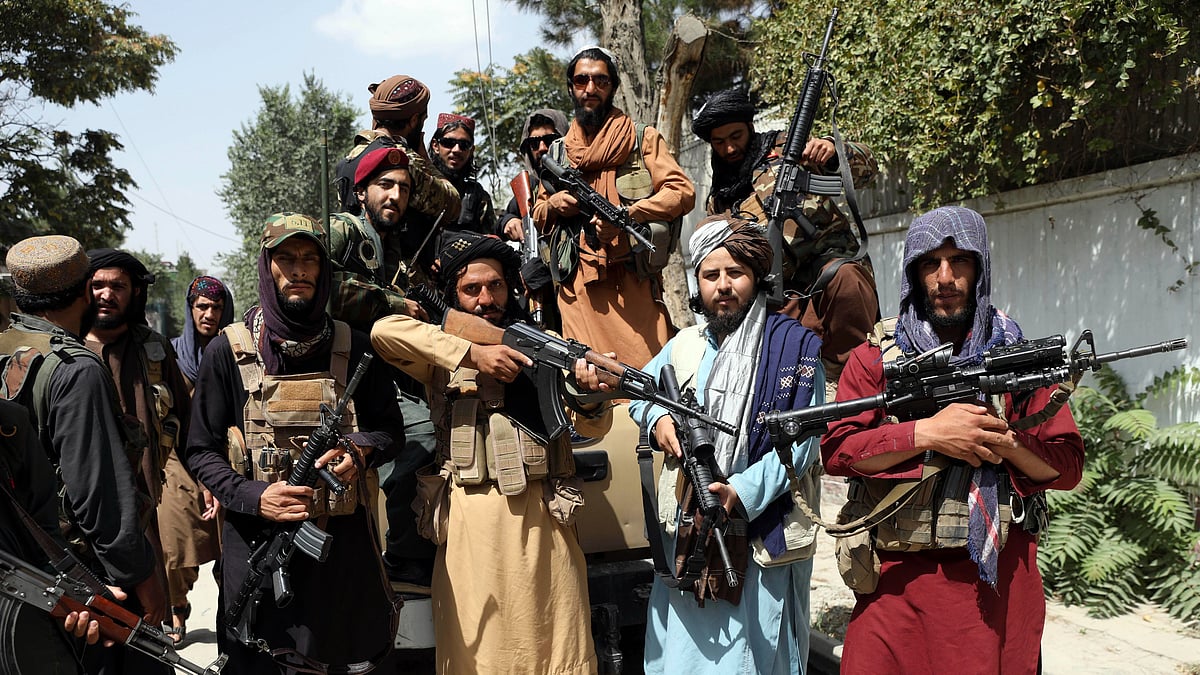 <div class="paragraphs"><p>Taliban fighters pose for a photograph in Kabul, Afghanistan.</p></div>