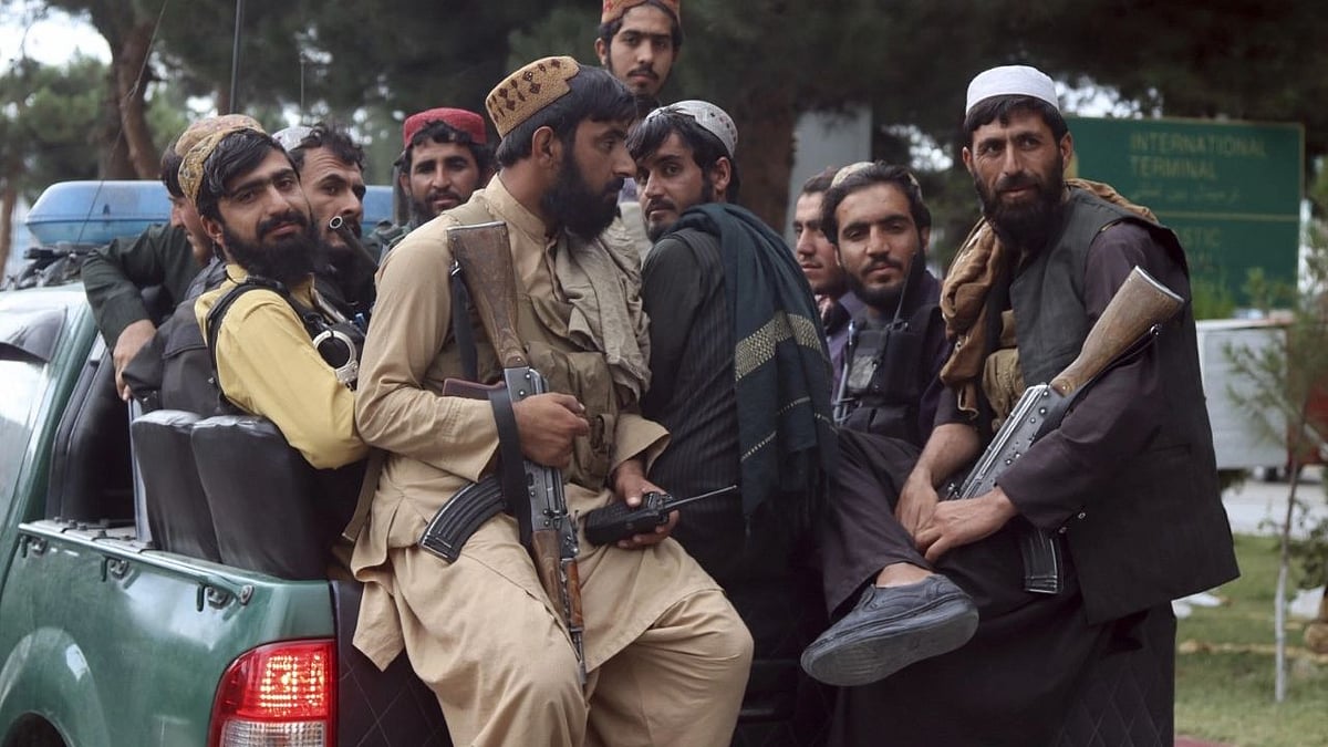 <div class="paragraphs"><p>Taliban fighters arrive inside the Hamid Karzai International Airport in Kabul after the US military's withdrawal from Afghanistan, 31 August. Image used for representation purpose.</p></div>