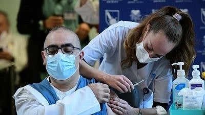 <div class="paragraphs"><p>File photo of an Israeli medical worker receiving a COVID-19 vaccine at the Sourasky Medical Center in Tel Aviv, Israel </p></div>