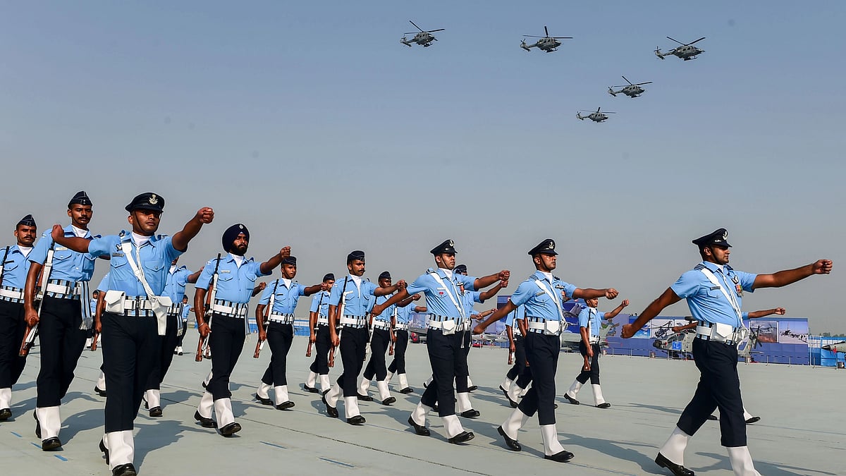 <div class="paragraphs"><p>Ghaziabad: Indian Air Force (IAF) personnel march past as IAF helicopters perform an air display during 89th foundation day of the force, at Hindon Airbase, 8 October.</p></div>