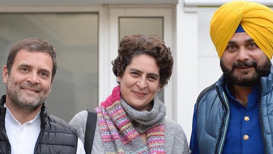 <div class="paragraphs"><p>Navjot Singh Sidhu with Rahul and Priyanka Gandhi. File photo. </p></div>