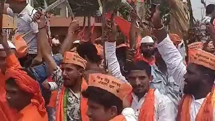 <div class="paragraphs"><p>People from the Bajrang Dal dancing with swords in the middle of the road on the eve of Ayudha Pooja.&nbsp;</p></div>