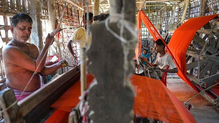 <div class="paragraphs"><p>Weavers at work; Image used for representation only</p></div>