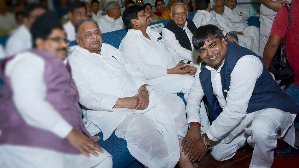 <div class="paragraphs"><p>A file photo of Gayatri Prajapati as he touches the feet of Samajwadi party patriarch Mulayam Singh Yadav. </p></div>