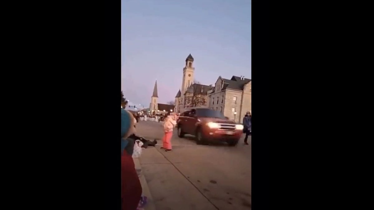 <div class="paragraphs"><p>A red SUV sped past a little girl before mowing down a Christmas parade.</p></div>