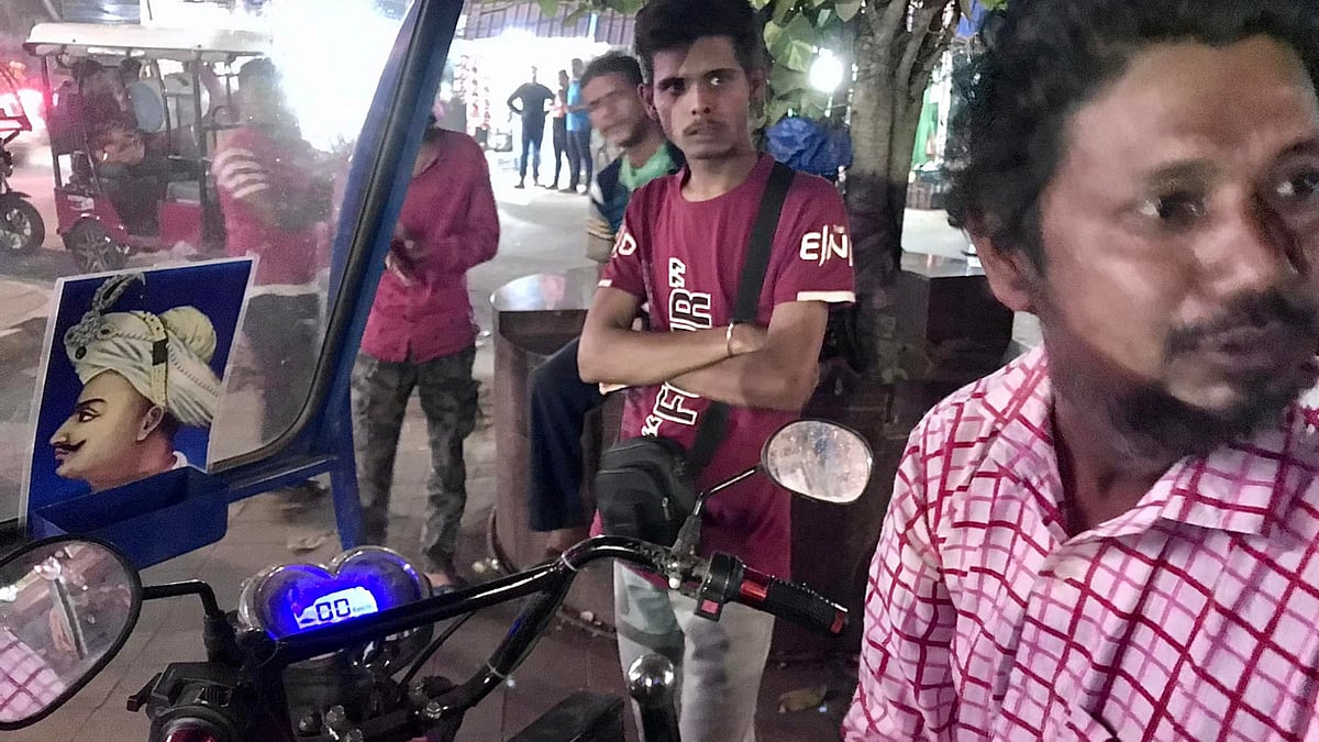 <div class="paragraphs"><p>Bengal auto driver Suranjan Karmakar (extreme right).</p></div>