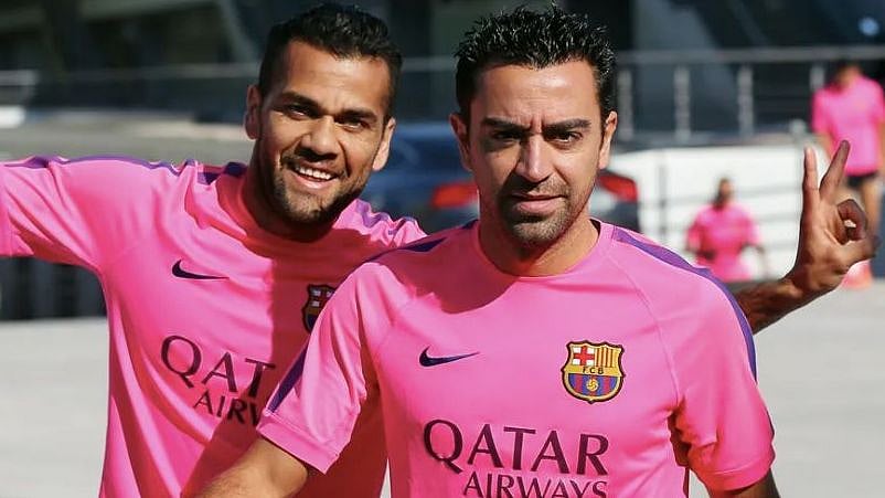 <div class="paragraphs"><p>Dani Alves and Xavi Hernandez</p></div>