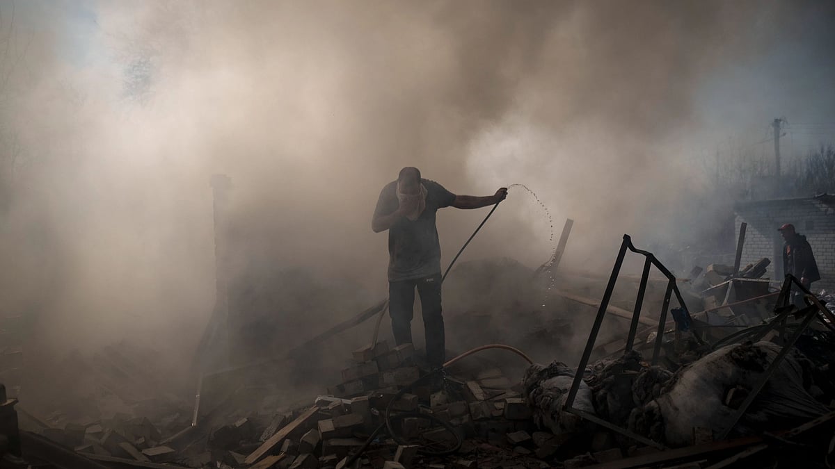 <div class="paragraphs"><p>Neighbours trying to extinguish the fire in a house destroyed by a Russian attack in Kharkiv, Ukraine. </p></div>
