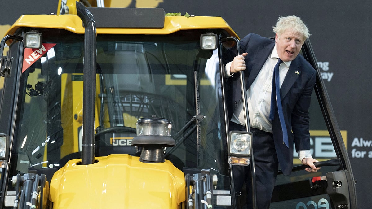 <div class="paragraphs"><p>UK Prime Minister Boris Johnson climbs onto a JCB at the new JCB Factory in Vadodara.<br></p></div>