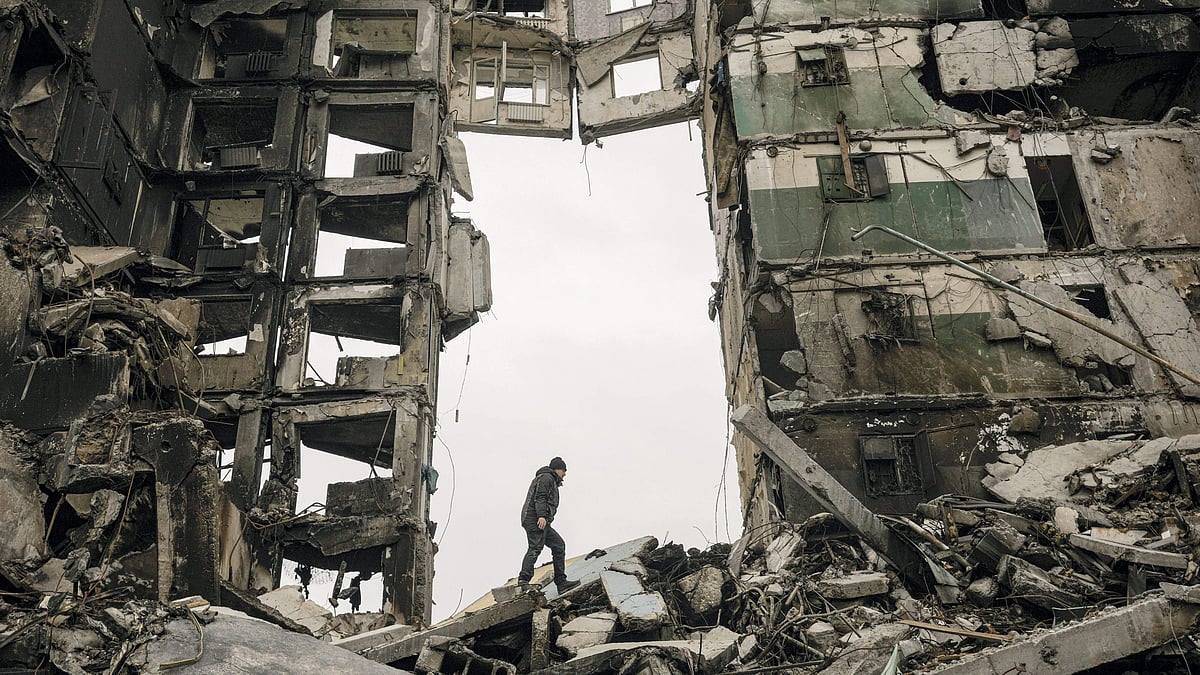 <div class="paragraphs"><p>A resident looks for belongings in an apartment building destroyed during fighting between Ukrainian and Russian forces in Borodyanka, Ukraine, Tuesday, 5 April.</p></div>