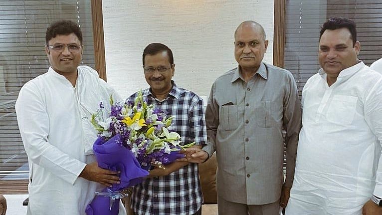 <div class="paragraphs"><p>Former Haryana Congress chief Ashok Tanwar with AAP chief Arvind Kejriwal. </p></div>