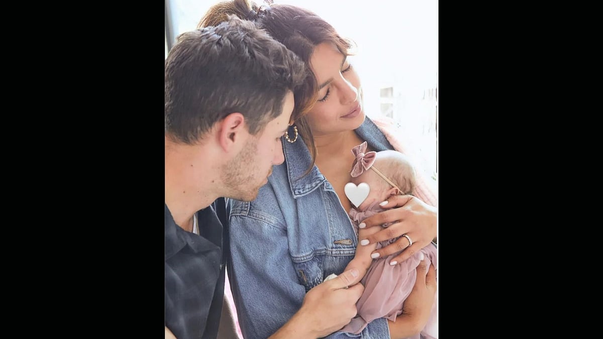 <div class="paragraphs"><p>Priyanka Chopra and Nick Jonas with their daughter. </p></div>