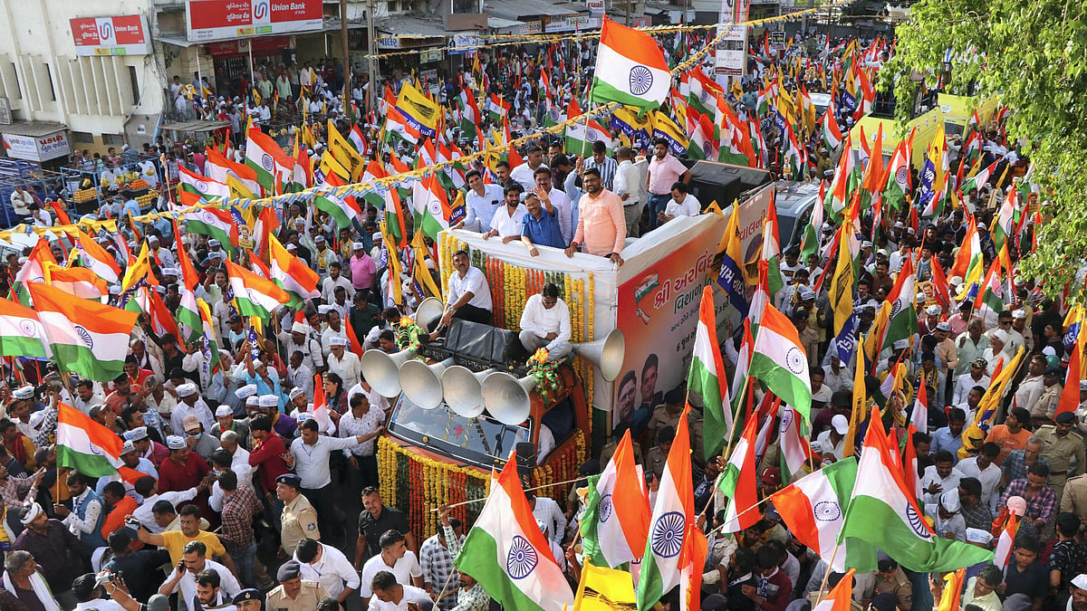 <div class="paragraphs"><p>Mehsana: Delhi Chief Minister and AAP Convener Arvind Kejriwal waves at the supporters during the party's 'Tiranga Yatra' roadshow, in Mehsana, on Monday, 6 June. </p></div>