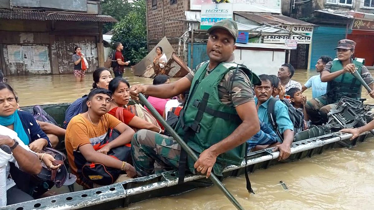 <div class="paragraphs"><p>Security personnel rescue people from a flood-affected area in Silchar, Monday, 20 June 2022.</p></div>