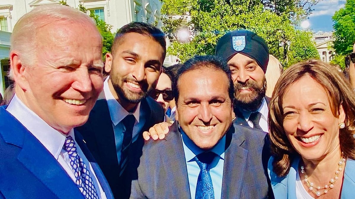 <div class="paragraphs"><p>Ajay Jain Bhutoria, between Joe Biden and Kamala Harris.</p></div>