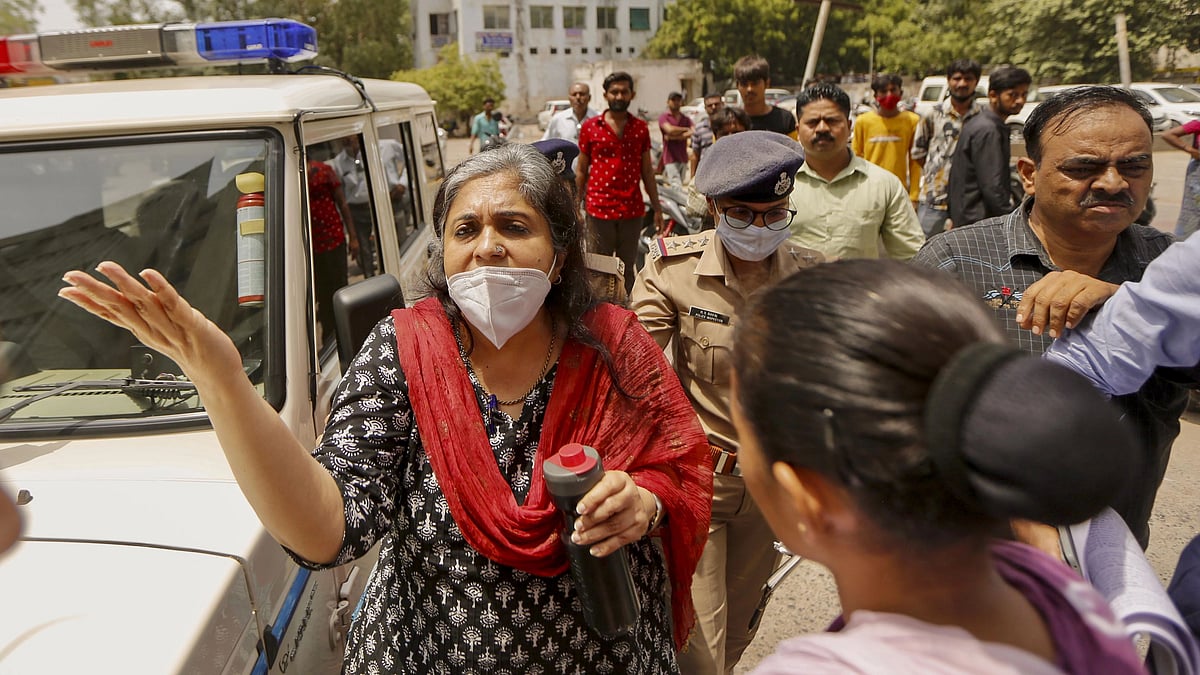 <div class="paragraphs"><p>Crime branch officials produce social activist Teesta Setalvad at Metropolitan Magistrate Court, in Ahmedabad.</p></div>