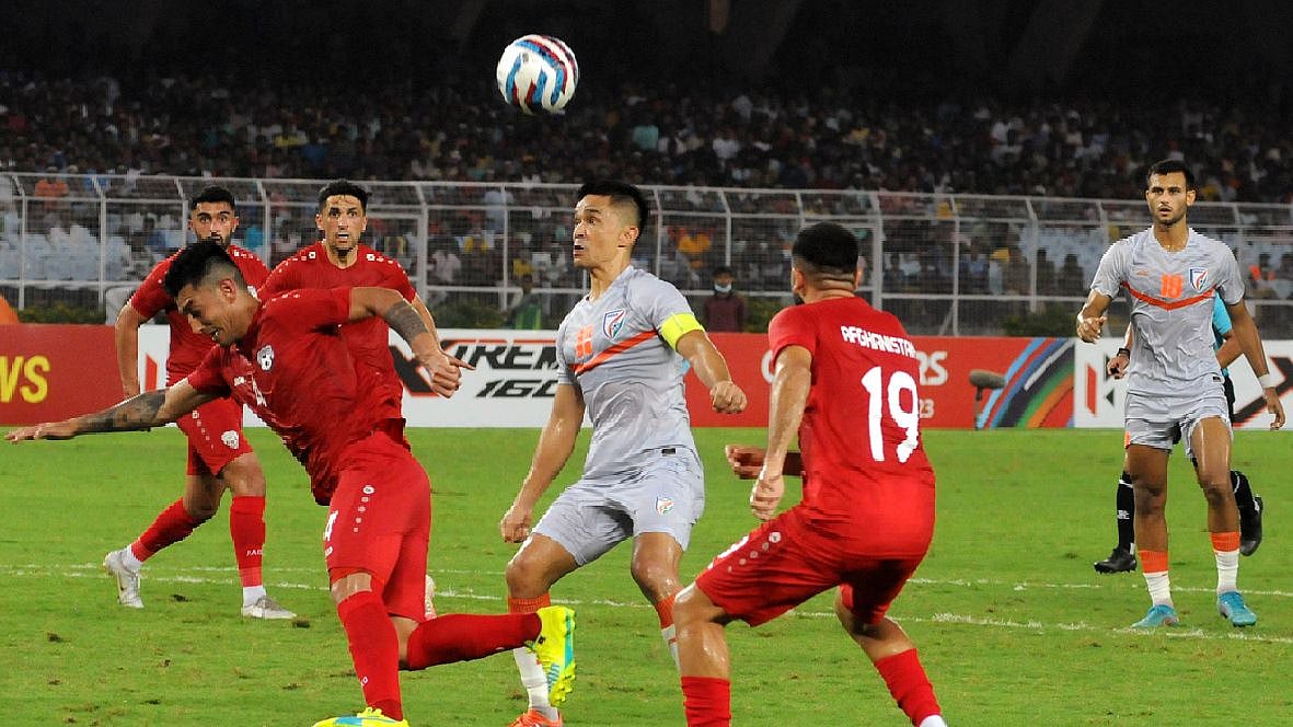 <div class="paragraphs"><p>Afghanistan's defenders try to stop Indian forward Sunil Chhetri during the AFC Asian Cup 2023 Qualifiers final round match at VYBK stadium in Kolkata.</p></div>