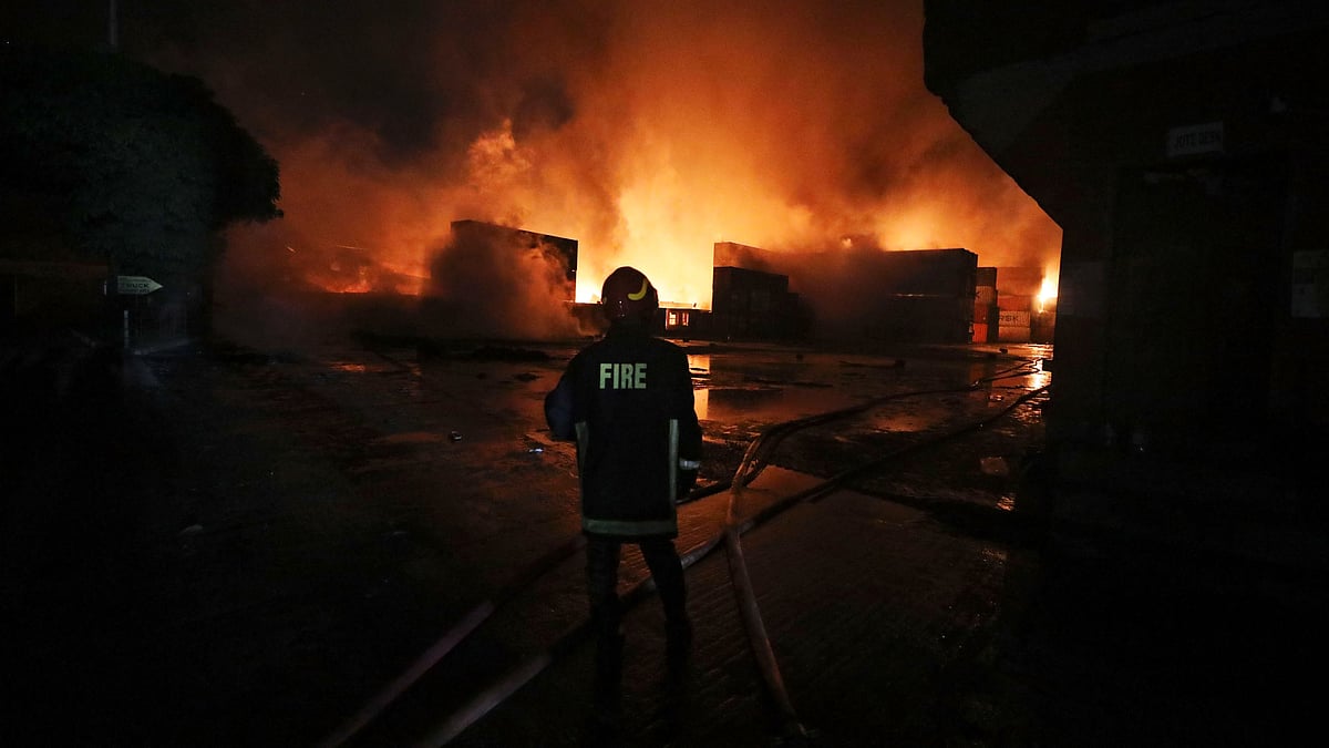<div class="paragraphs"><p>A firefighter works to contain a fire that broke out at the BM Inland Container Depot, a Dutch-Bangladesh joint venture, in Chittagong, 216 kilometers (134 miles) southeast of capital, Dhaka, Bangladesh, early Sunday, 5 June 2022. </p></div>