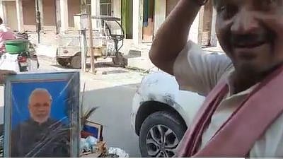 <div class="paragraphs"><p>A Mathura sanitation worker was sacked for carrying PM Modi and CM Adityanath's photos in his garbage cart.</p></div>