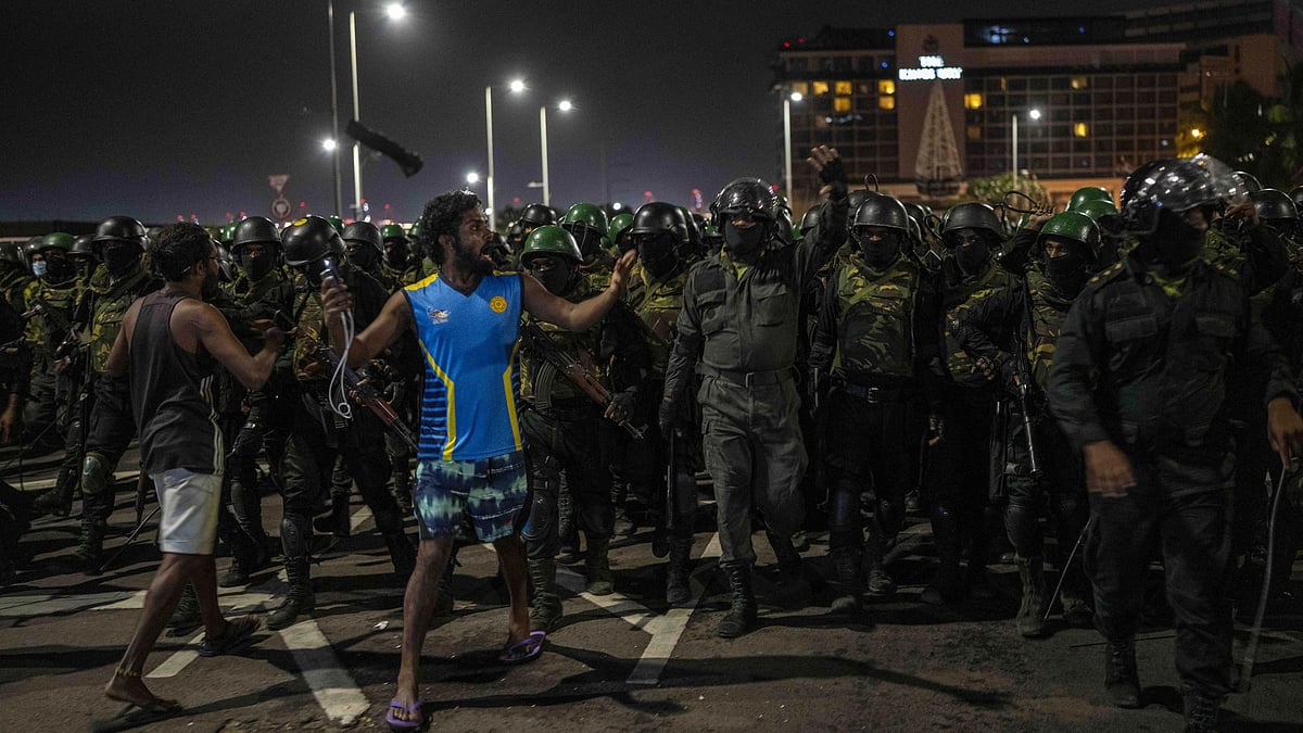 <div class="paragraphs"><p>A protester shouts slogans as army soldiers arrive to remove protesters from the site of a protest camp outside the Presidential Secretariat in Colombo, Sri Lanka, Friday, 22 July. </p></div>